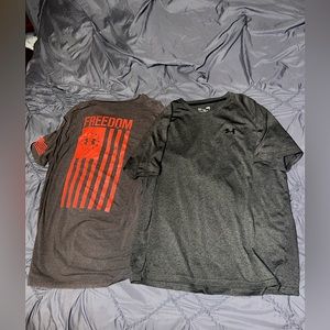 (2) Under Armour short sleeve shirts. (1) Med. (1) Large